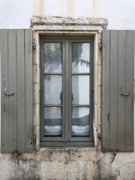istock Beautiful Old French Window with Grey Shutters 1170778714
