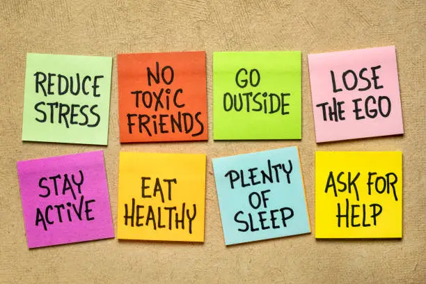 healthy lifestyle reminders - handwriting on a set of colorful sticky notes against textured paper