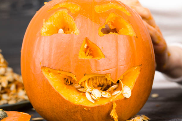 istock preparing a scary orange pumpkin lamp 1170784410
