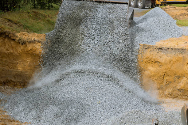 istock Excavator extracting backfill of foundation stone 1170788640