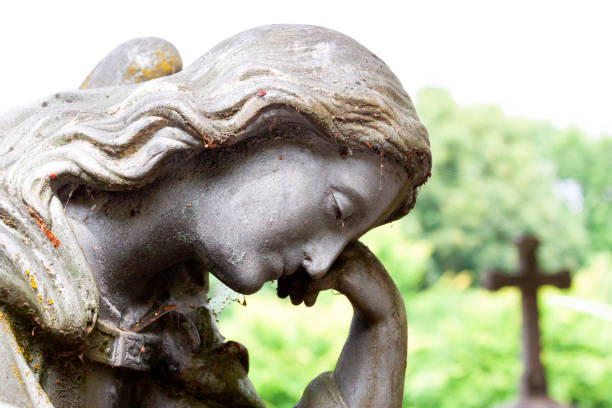 istock Old statue of angle in cemetery, background with copy space 1170789910