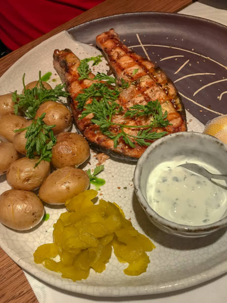 istock Grilled salmon with small unpeeled boiled potatoes. 1170791112