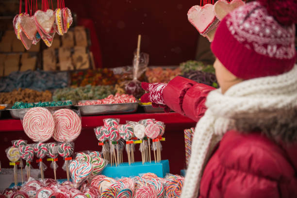 istock Girl looking at sweets on candy stand 1170793119