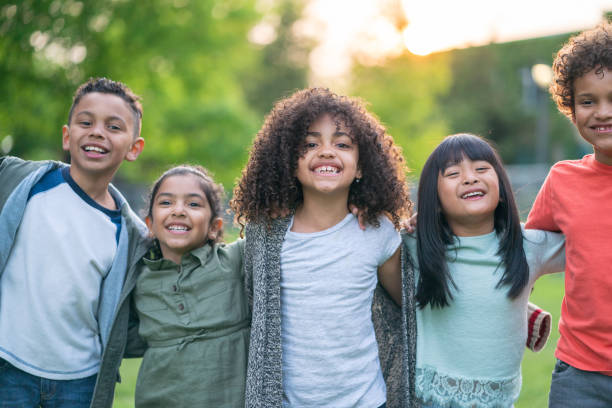 istock A group of smiling kids in the park 1170793912