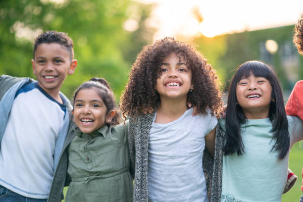 istock A group of smiling kids in the park 1170793914