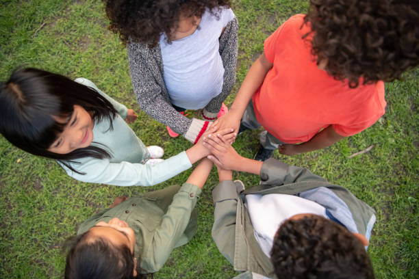 istock A group of children's hands 1170793917