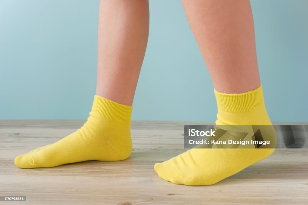 Walking in the room with socks. Foot Stock Photo