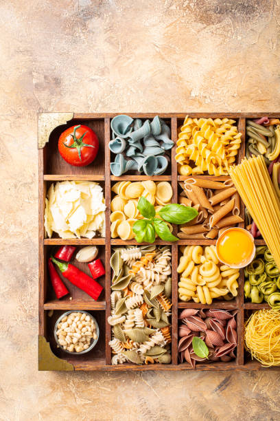 istock Assorted colorful italian pasta in wooden box 1170795557