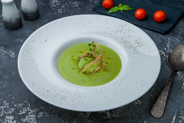 istock Cream of broccoli soup on dark grey concrete table 1170797231