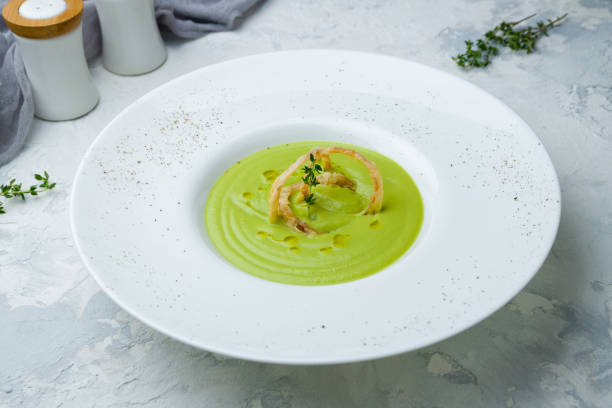 istock Cream of broccoli soup on grey concrete table 1170797304