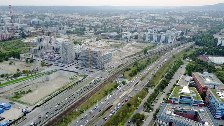 Traffic around construction site and crane - construction industry and development