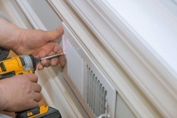 istock Man is holding hand drill in hands. Worker installing the wall vent works renovation in the flat. 1170808853