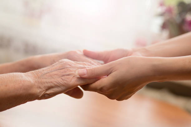 istock People holding on to each other. Young and old. 1170823723