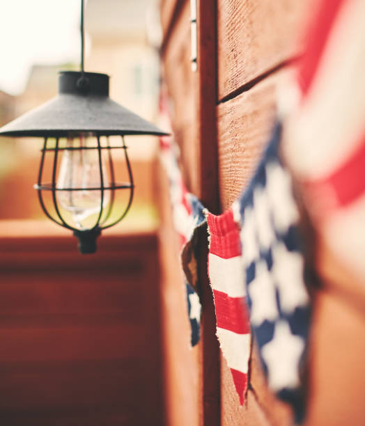 istock American flag background. Flag bunting hanging on fence 1170824531