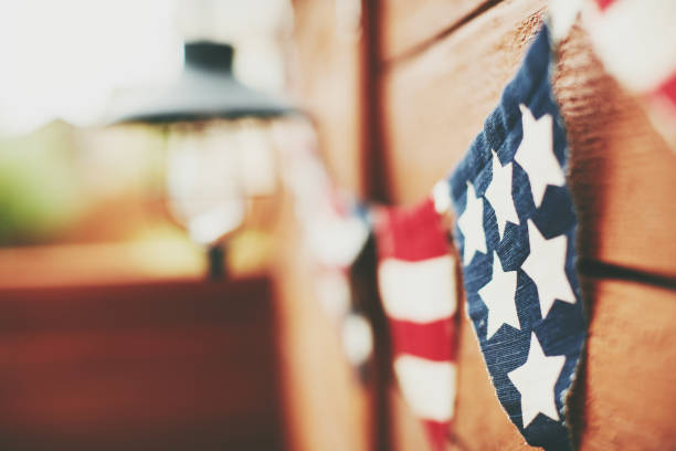 American flag background. Flag bunting hanging on fence