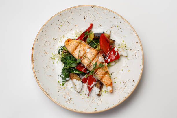 istock salmon steak with japan salad and sauce 1170824760