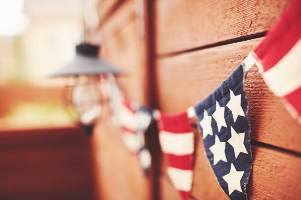 American flag background. Flag bunting hanging on fence