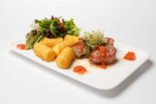 istock sauce medallions with cheese sticks and a vegetables 1170825525