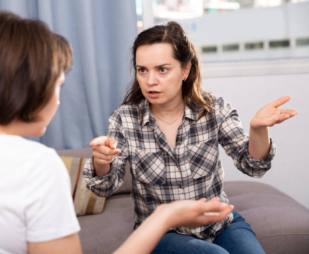 istock Two unhappy woman having conflict at home 1170841130