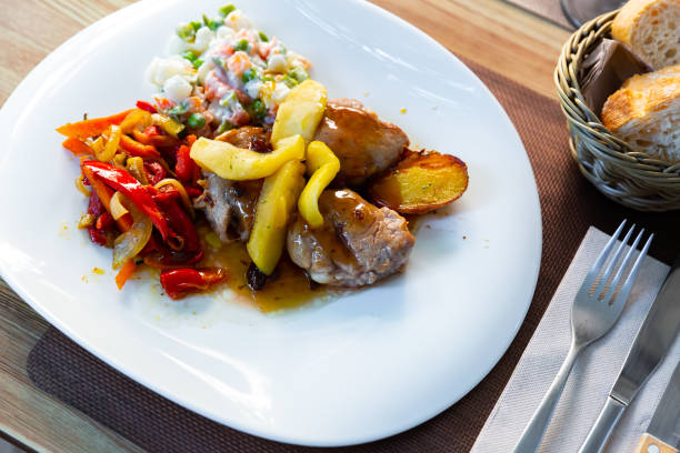 istock Grilled pork sirloin with caramelized apple, peppers and salad 1170841488
