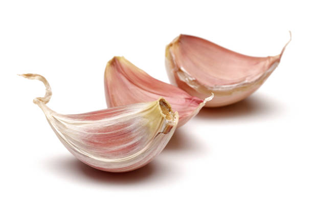 istock Garlic cloves isolated on white 1170842432