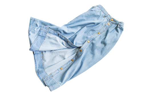 Crumpled blue denim long skirt isolated over white