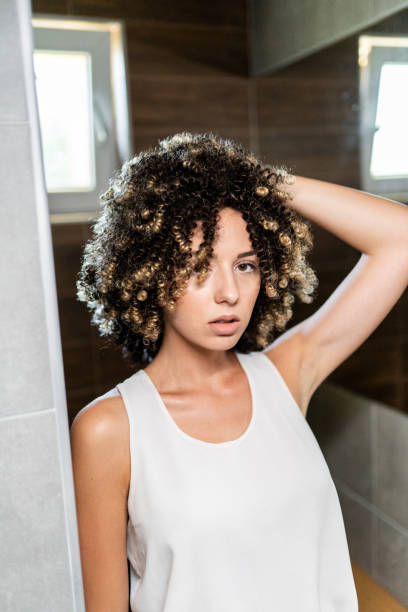 istock Young beautiful woman posing in bathroom 1170846056