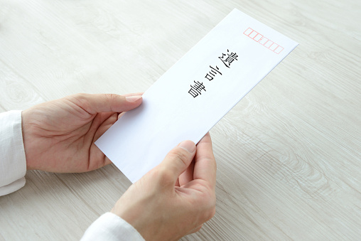 Person's hands having last will and treatment in Japanese