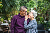 Outdoor Portrait of Devoted Senior Chinese Husband and Wife