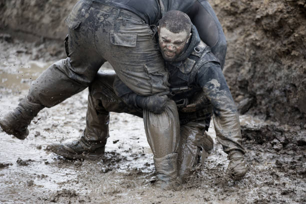 istock Krav Maga military muddy fighting duo 1170853269