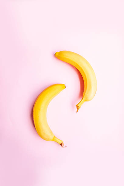 istock Flat lay of two bananas on pink background. 1170853493