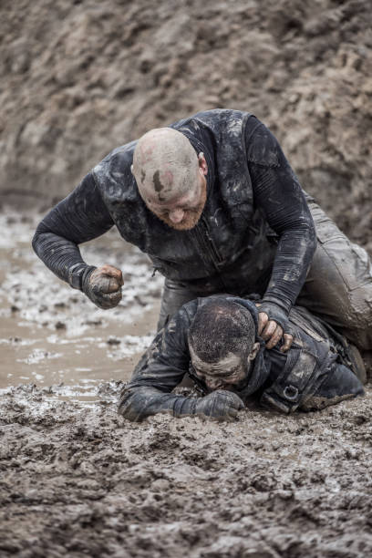 istock Krav Maga military muddy fighting duo 1170853504