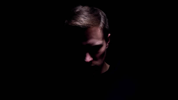 istock Shadowed man looking down, maniac preparing for cruel murder, criminal 1170855479