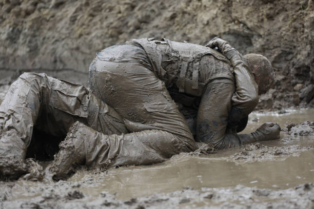 istock Krav Maga military muddy fighting duo 1170855619
