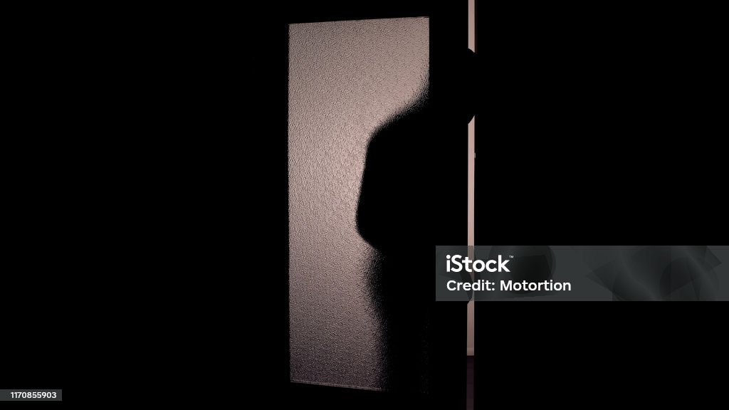 Dark shadow of hooded man opening glass door, danger of burglary dark background Door Stock Photo