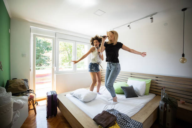istock Two young women having fun in apartment 1170859032