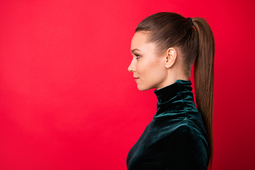 Close-up profile side view portrait of her she nice-looking attractive winsome pretty lovable charming cute calm straight-haired lady copy, space isolated over bright vivid shine red background