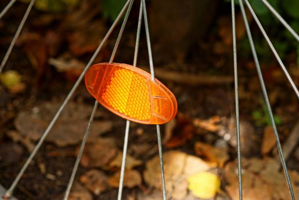 istock red plastic reflector on gray metal wheel spokes 1170871736