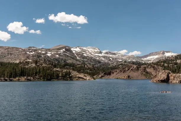 View of Ellery Lake with snow in summer