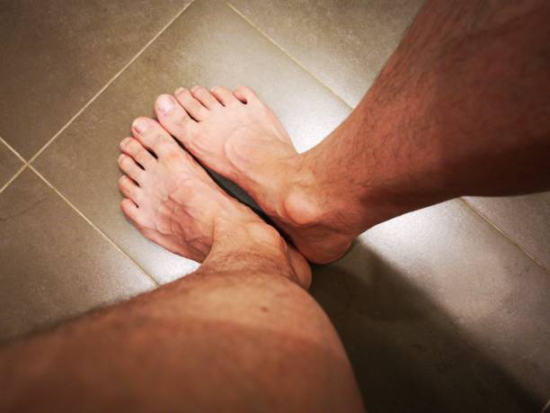 Foot on bathrom floor in perspective