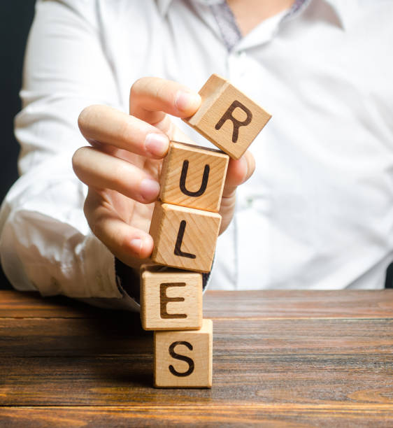 istock A man breaks the rules. Moral and ethical violations. Go against the law and system, non-recognition of the code of honor. Loopholes laws. Unreliable and dishonest business partner. Unprofessionalism 1170874453