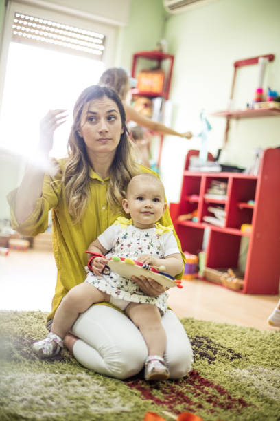 istock Baby and teacher time. 1170875835