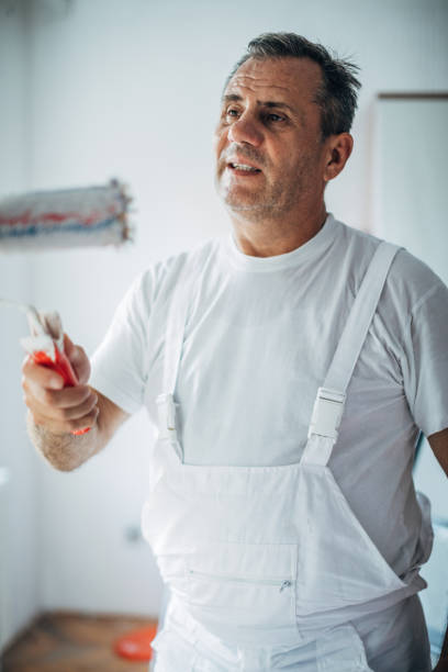 istock Man painting home 1170876867