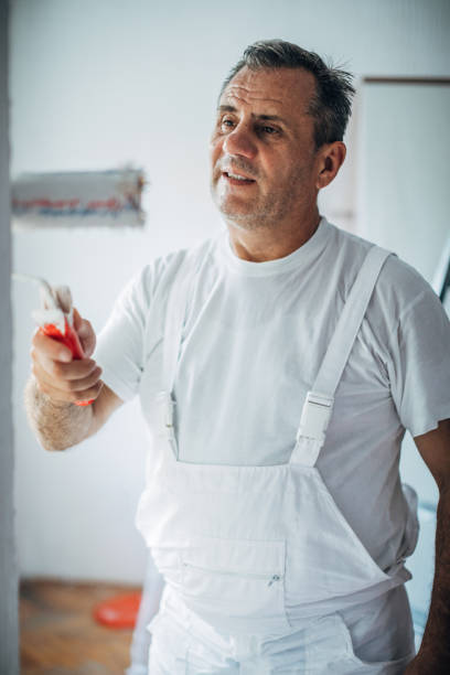 istock Man painting walls at home 1170877296