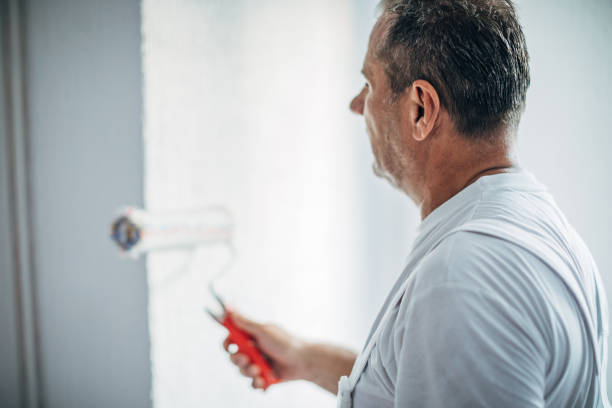 istock Man painting apartment 1170877330