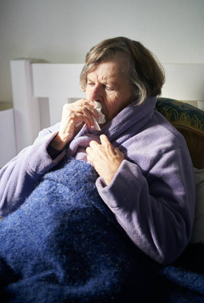 istock Suffering from flu, a senior woman rests in bed 1170879684