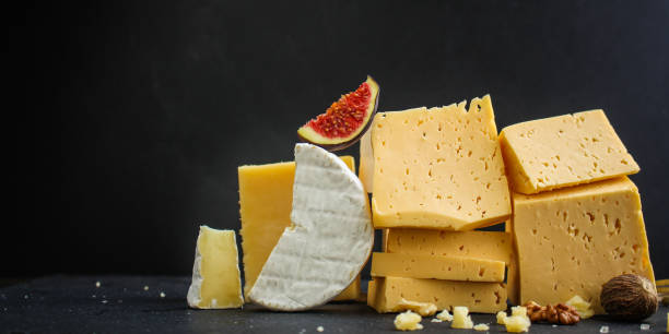 istock cheese, different types and forms (hard, soft, a lot of cheese product) healthy food concept. food background. copy space 1170884425