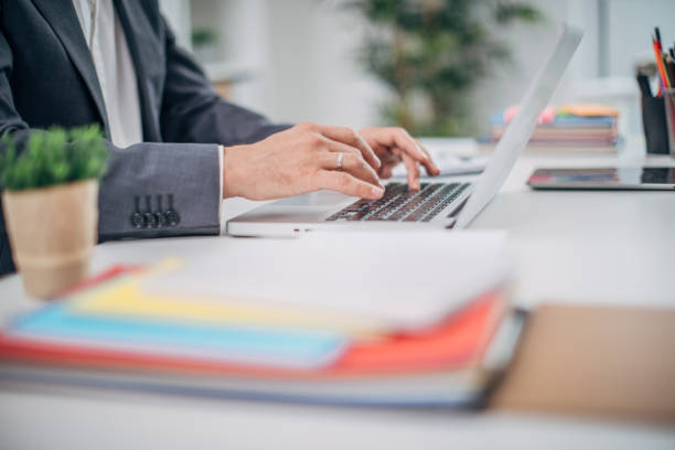 istock Businessman typing on laptop 1170887475