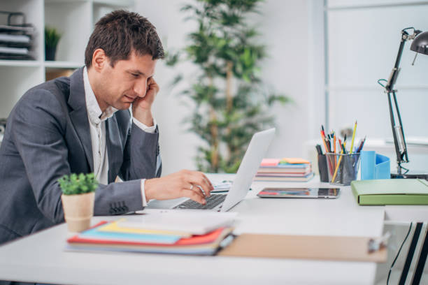istock Man working on laptop in his office 1170887689