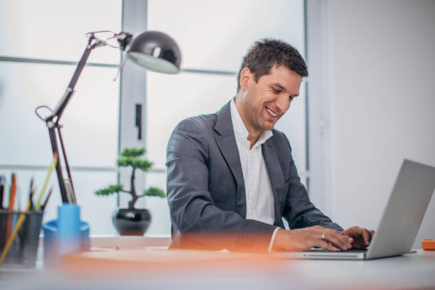 istock Happy  businessman working on laptop 1170887866